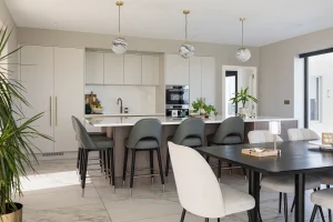 Contemporary Kitchen with Smoked Oak Island, Ammonite Cabinets and Brass Hardware Doran Kitchens