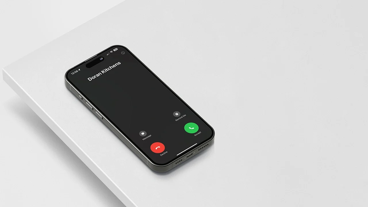 iphone-calling-doran-kitchens-get-in-touch iPhone on Light Grey Counter Top with Incoming Call from Doran Kitchens